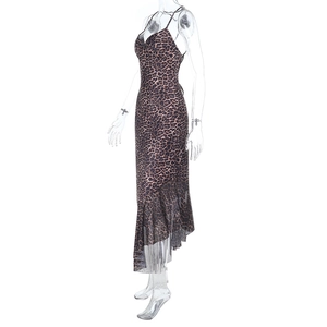 Detail of leopard print camisole dress featuring asymmetric ruffled mesh hem and V-neckline