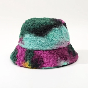 Detail showing colorful tie-dye faux fur bucket hat with thick plush texture and warm material