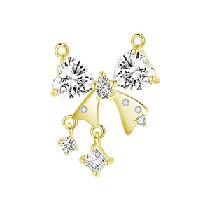 Detailed close-up of golden bow-shaped pendant with heart and teardrop zircons