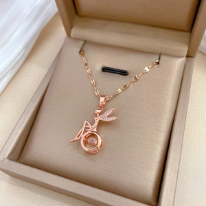 Elegant rose gold titanium angel necklace with a dancing crystal pendant on a velvet box