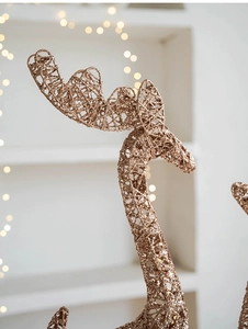 Detail of champagne gold wire Christmas deer ornament with sparkling glitter finish