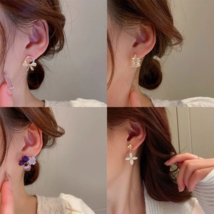 Collage of four opal and rhinestone earrings showcasing various geometric and floral styles