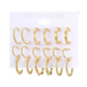 12-piece gold hoop earrings set with diverse textured finishes on white display card