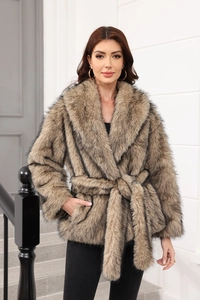 Detail of tan faux fur coat featuring thick plush texture and belted waist design