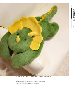 Macro shot of green plush triceratops showing soft long-pile texture and yellow horns