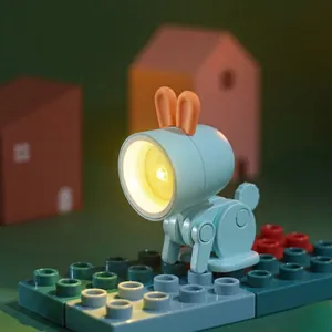 Mini bunny LED night light with adjustable limbs in blue and orange on colorful base