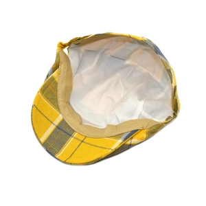 Yellow plaid beret cap with adjustable metal buckle and soft inner lining shown from above