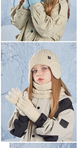 Close-up of children's thick cable knit winter set with gloves and neck warmer
