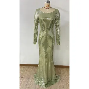 Detail of high-density light gold sequins on long-sleeved evening gown with floor-length hem