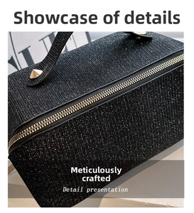 Close-up detail of high-density black glitter fabric and golden zipper on makeup bag