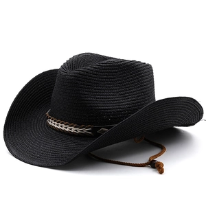 Close-up of black straw cowboy hat featuring a brown woven belt and adjustable chin strap