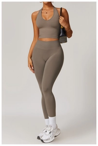 Detail of taupe ribbed high-waist yoga set featuring a deep V-neck halter top and leggings