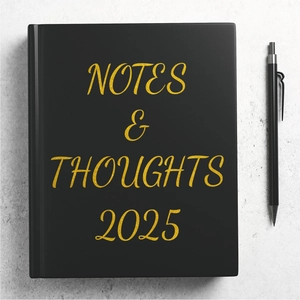 Detail of 2025 yearly planner with golden embossed typography on a black matte cover
