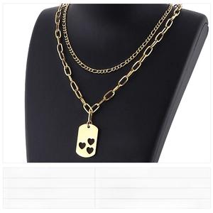 Detail of gold double-layer stainless steel necklace with hollow heart square pendant