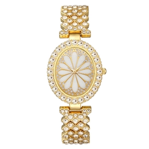Montre à quartz dorée pour femme avec cadran ovale marguerite et strass étincelants