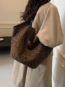 Fashionable leopard print tote bag with black straps and spacious interior for women