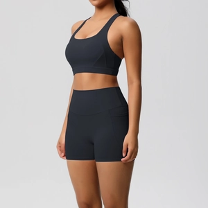 Detail view of high-waist yoga shorts with side pocket and contoured stitching