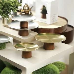 Elegant tiered metal cake stand with wooden base for desserts and fruit display