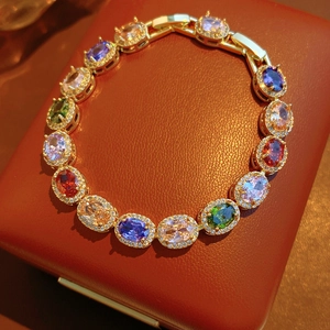 Detailed macro view of vintage oval colorful gemstone bracelet with cubic zirconia paving