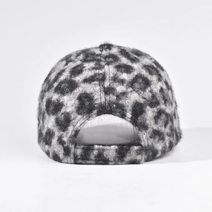 Detail view of leopard print plush baseball cap showing back adjustment strap texture