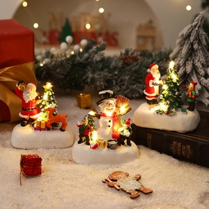 Luminous resin Christmas micro-landscape featuring Santa, snowmen, and LED house ornaments