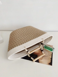 Handwoven cotton rope tote bag with khaki stitching and round wooden handles for summer