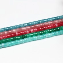 Flat round natural stone spacer beads in blue, pink, and green for DIY jewelry making