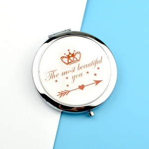 Portable silver metal folding makeup mirror with rose gold crown and heart pattern