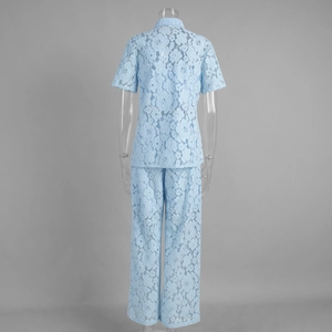 Back view of light blue lace two-piece set featuring sheer floral crochet shirt and trousers
