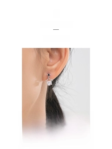 Detail of S925 silver star earring with center zircon and black diamond-shaped drop glaze