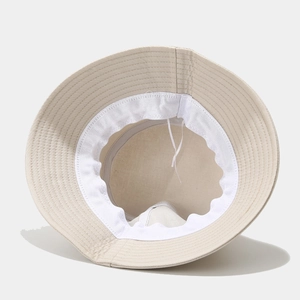 Beige wide brim bucket hat with interior adjustable drawstring and sweatband detail