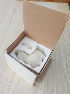 Safe packaging of ceramic cigar holder in white foam and cardboard box for shipping