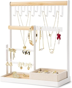 Detail view of white jewelry organizer with wooden bars and beige velvet ring slots