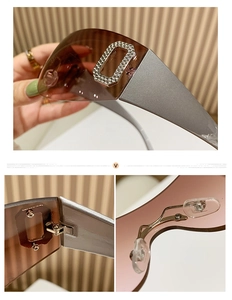 Detail showing gradient lenses, rhinestone D-letter hinge, and adjustable nose pads