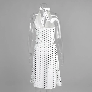 Detailed back view of halter neck polka dot top with tie back and matching skirt
