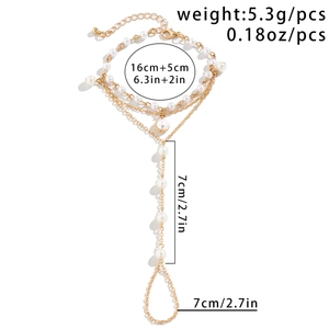 Detail view of gold pearl hand chain with precise weight and size dimensions labeled