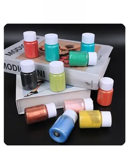 Detailed view of colorful pearlescent mica powder bottles for DIY slime and crafts