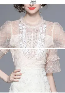 Vue détaillée de la broderie florale française et de l'applique 3D sur robe dentelle