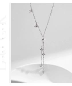 Detail of S925 silver star tassel Y-necklace with sparkling zircon stones and long chain