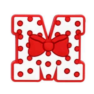 Macro shot of letter M PVC shoe charm with red polka dot pattern and bow detail