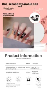 Detailed view of dark aesthetic press-on nails with bow, pearls and silver glitter