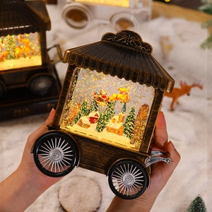 Vintage bronze Christmas lantern cart featuring Santa and reindeer with sparkling snow