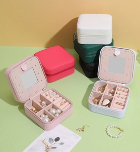 Detailed internal layout of portable leather jewelry box with mirror and ring slots