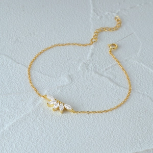 Detailed close-up of 925 silver gold bracelet with marquise-cut crown zircon stones