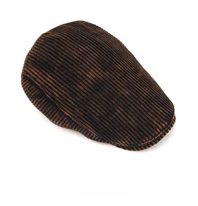 Top view of thick rib-knit tie-dye newsboy cap showing detailed brown wool texture