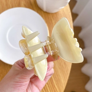 Elegant cream butterfly acetate hair claw clip for high ponytail styling and accessorizing