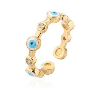 Macro view of adjustable evil eye ring with blue enamel and cubic zirconia stones