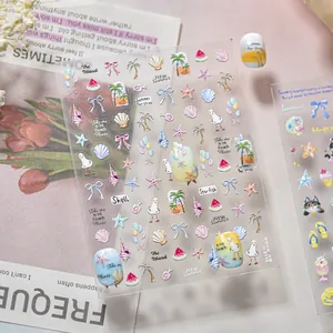 Detailed macro view of summer beach themed nail stickers with seashells and palm trees