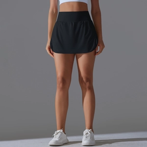Detail of high waisted black tennis skort with side slit design for athletic movement
