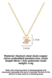 Close-up of pink rabbit pendant necklace with gold titanium chain and dimensions